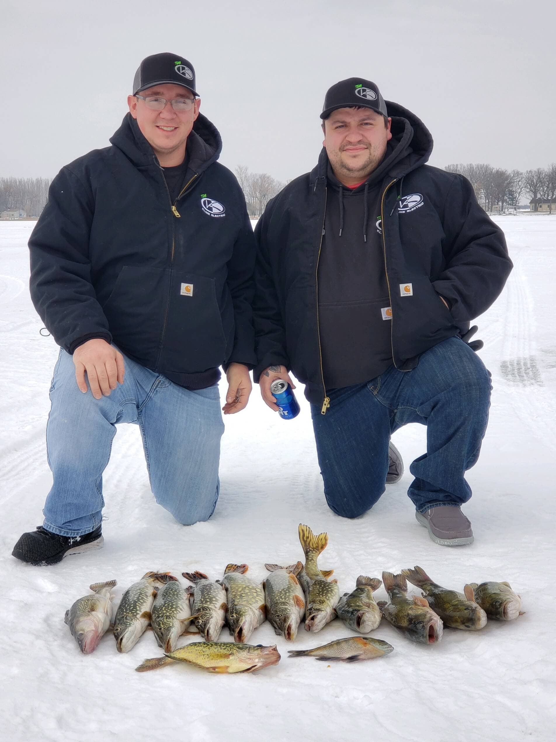Two guys with mixed catch ice fishing
