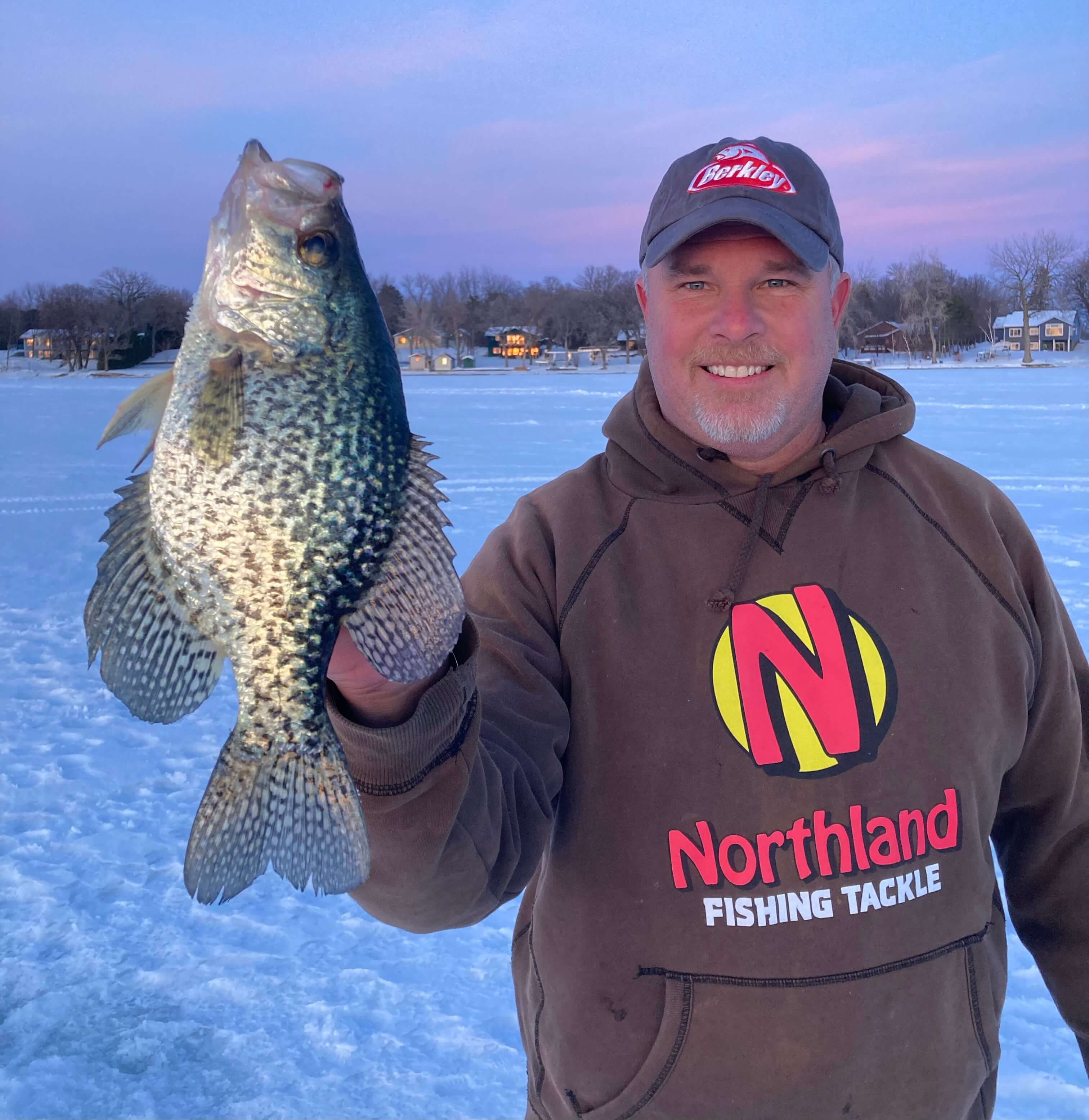 Captain Josh with 16-inch crappie on ice