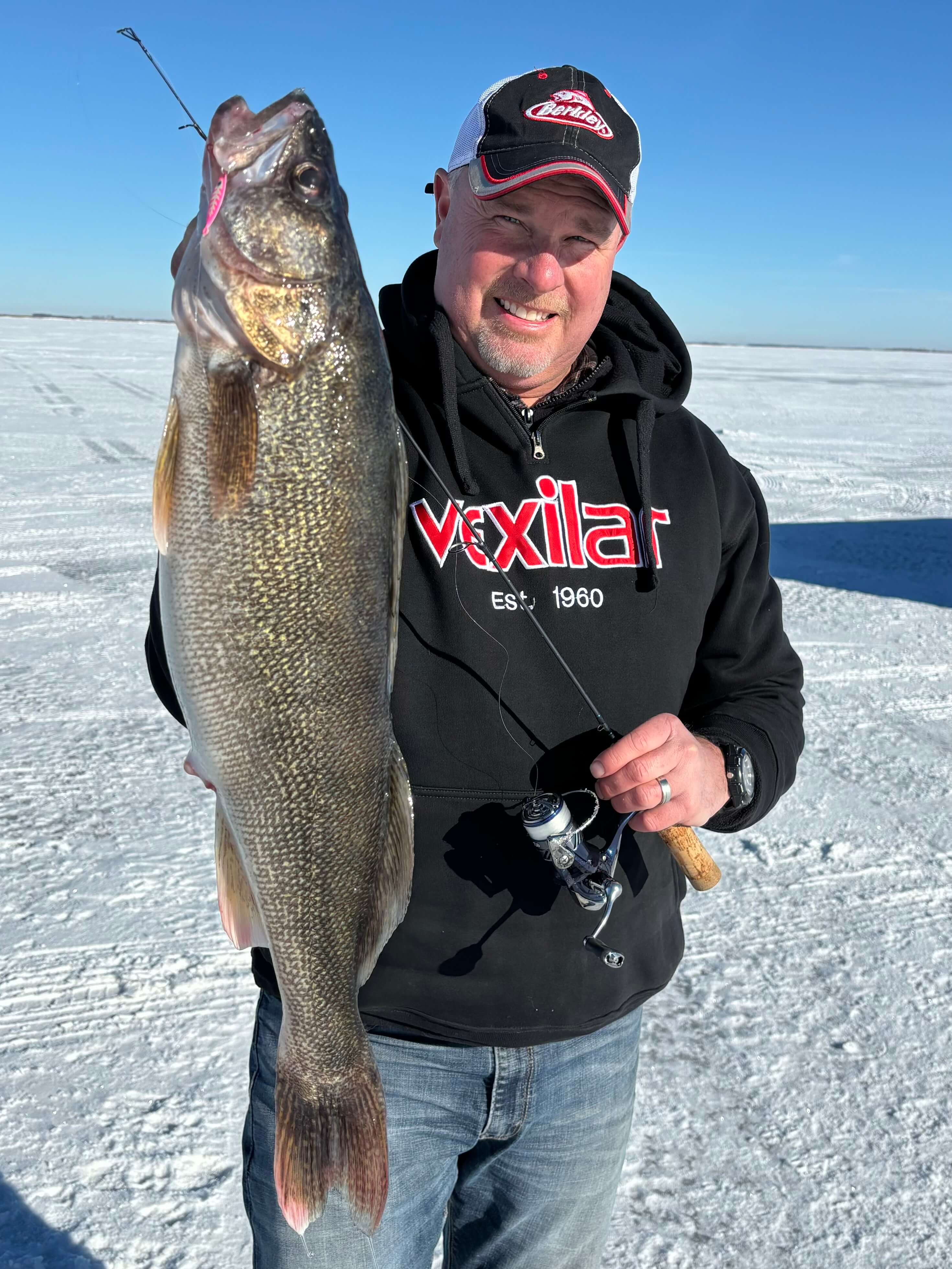 Captain Josh with walleye caught ice fishing
