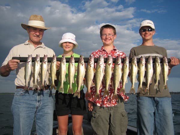 Happy angler with walleye on guided trip