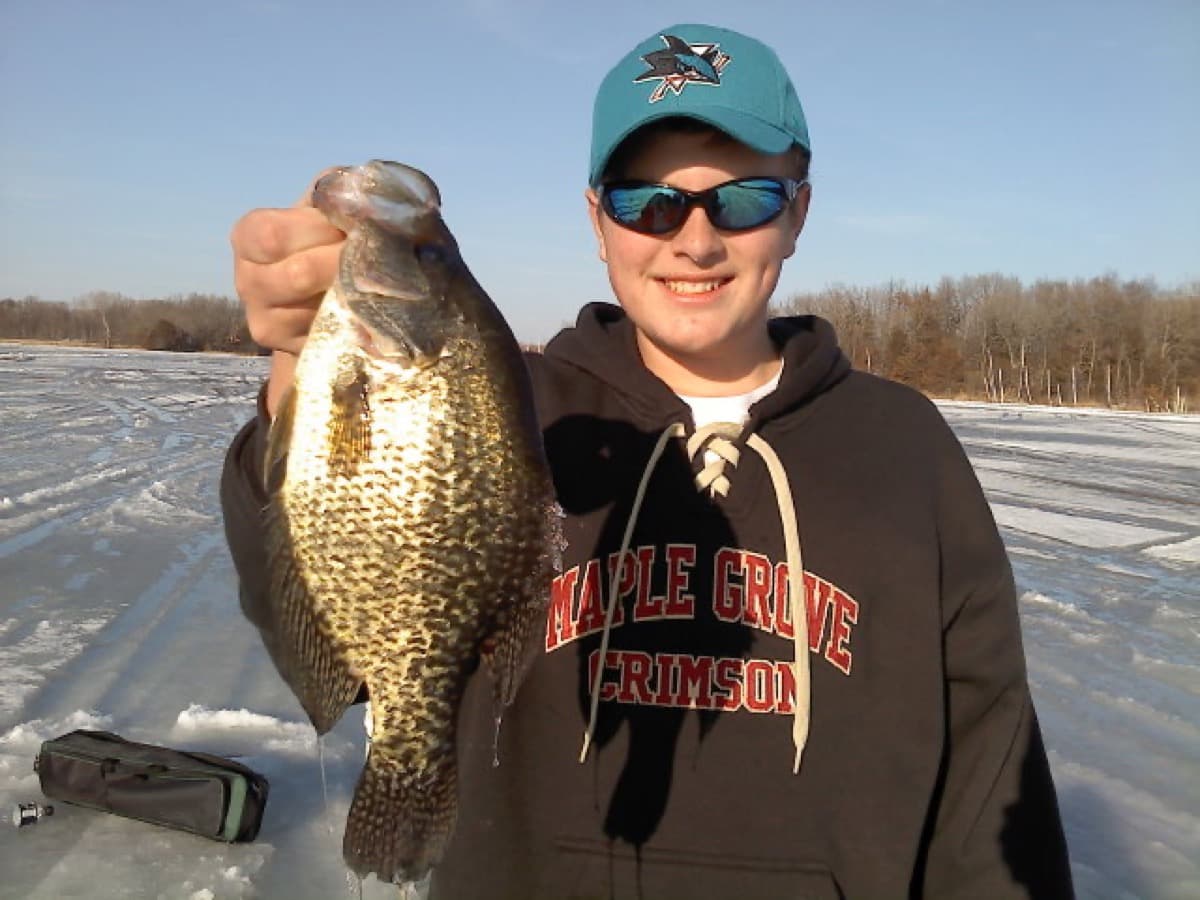 Noah with a crappie on the ice