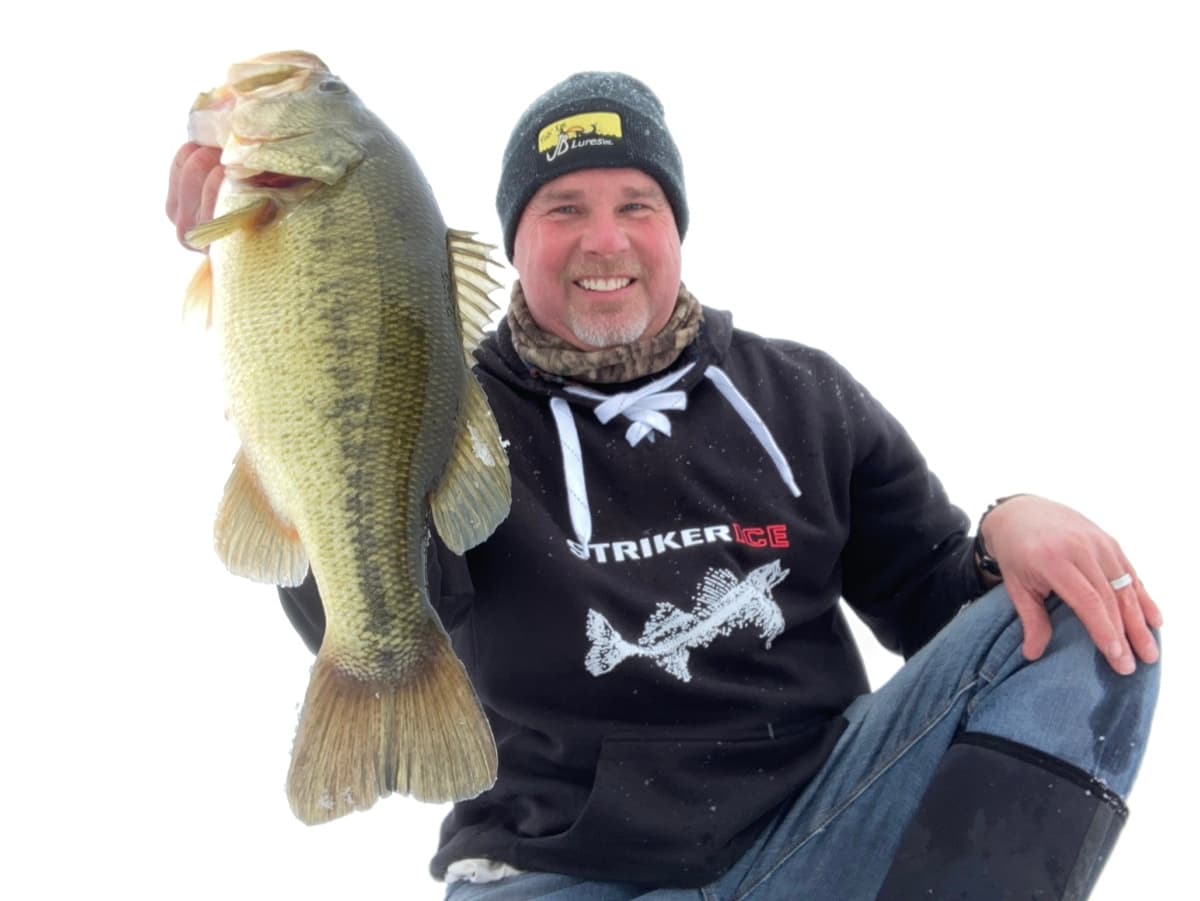 Captain Josh with a big bass on the ice