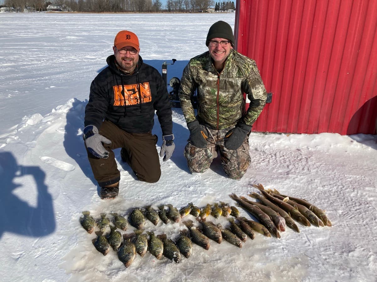 Two guys with crappies and pike