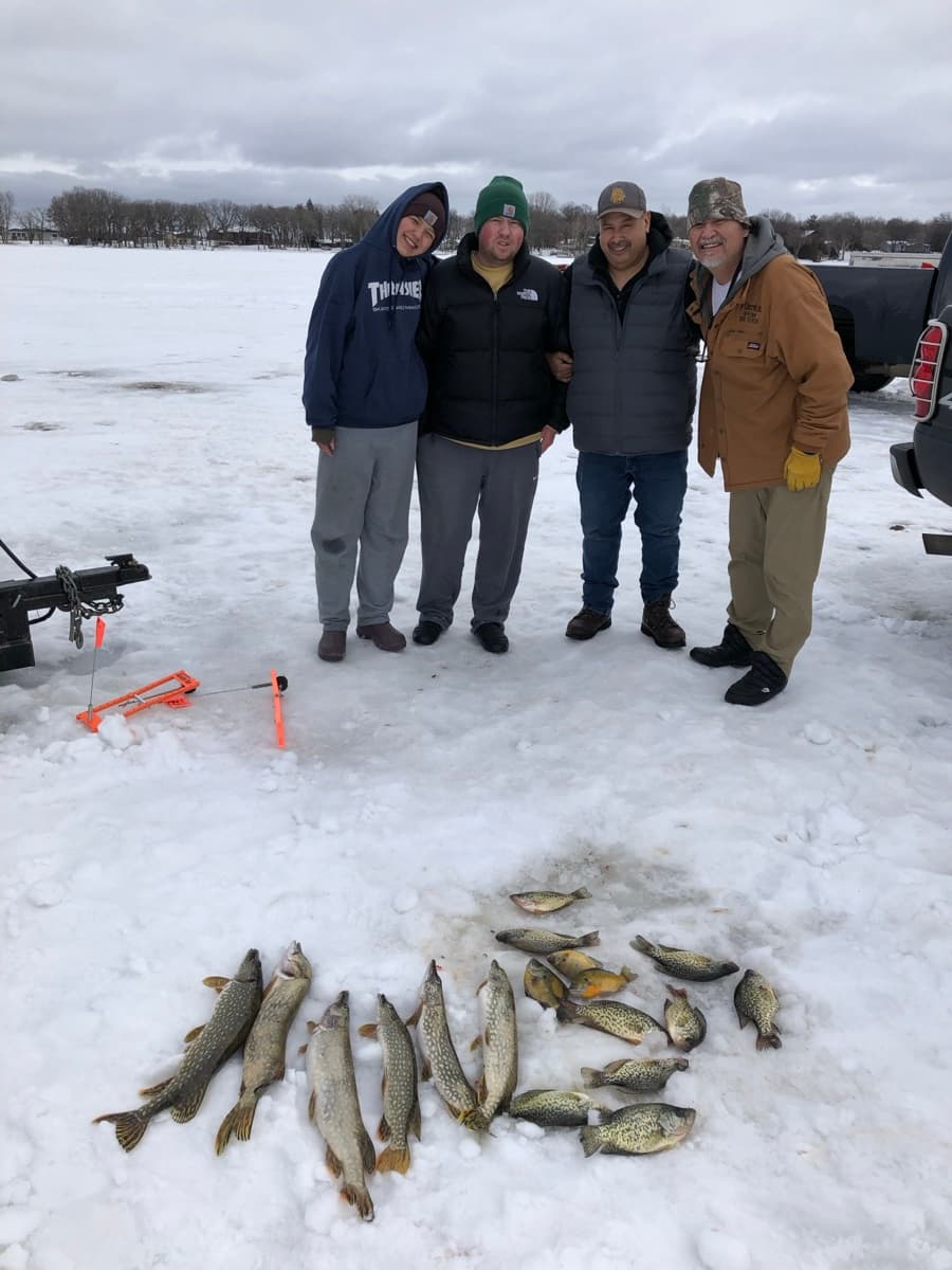 Family ice fishing trip with pike, crappies, and sunfish