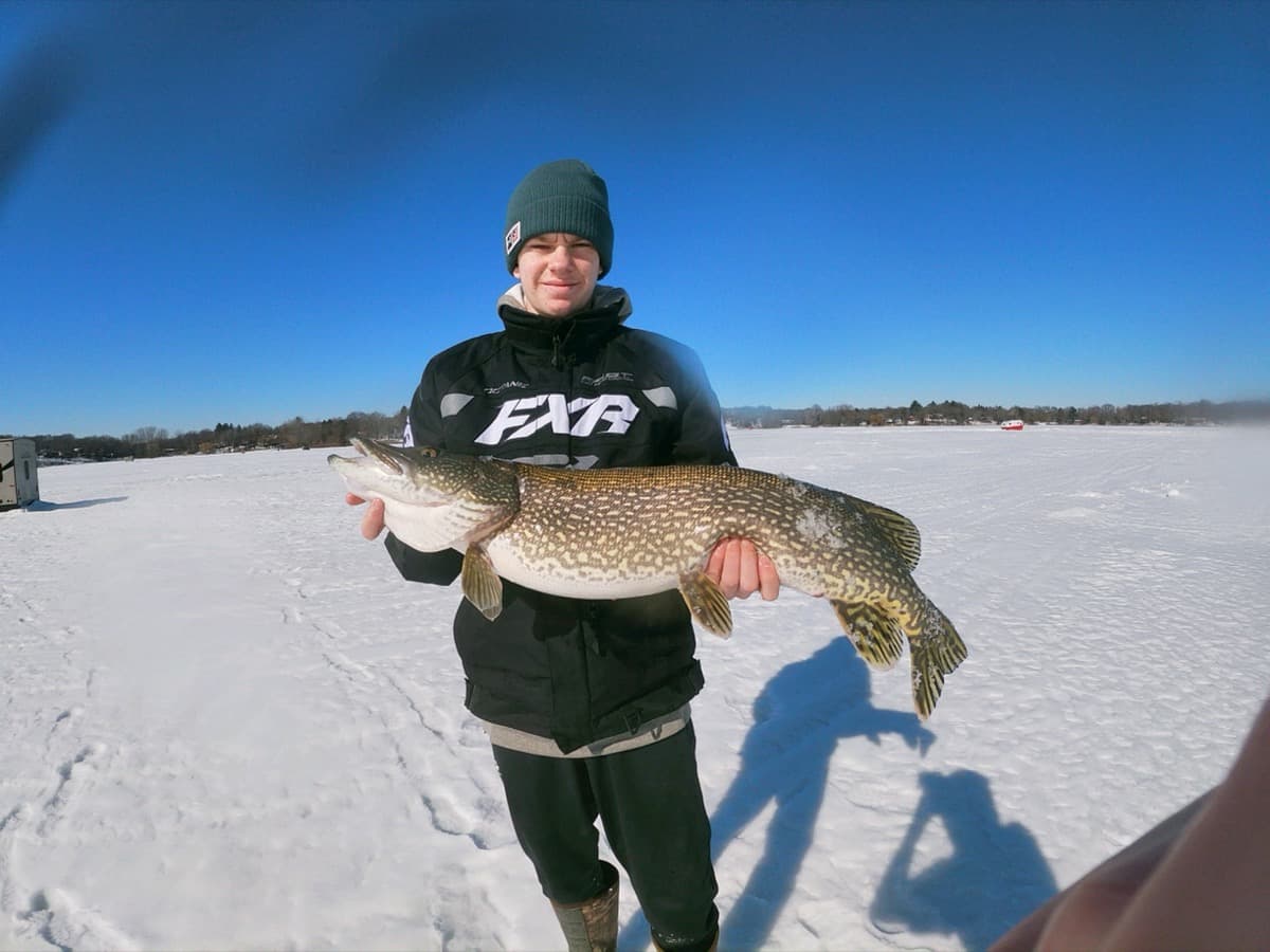 Riley with a pike caught ice fishing