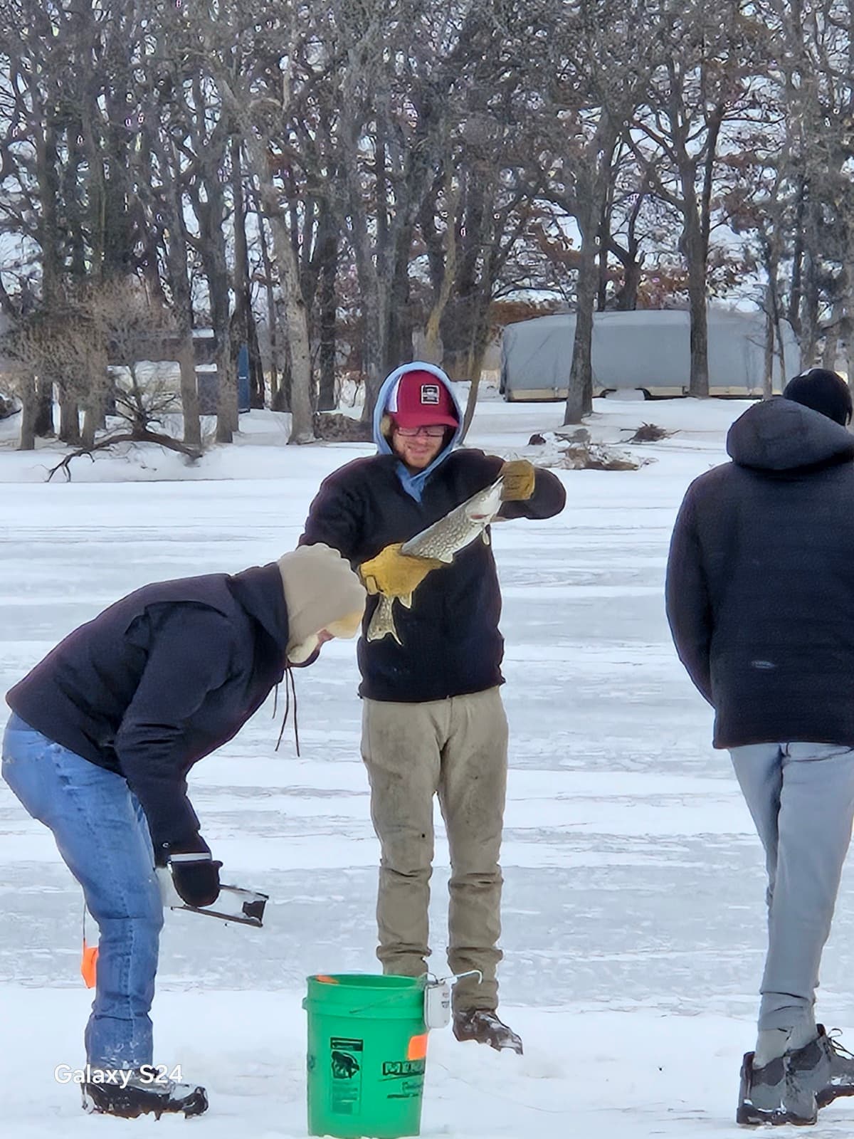 Pike tip-up scene on the ice