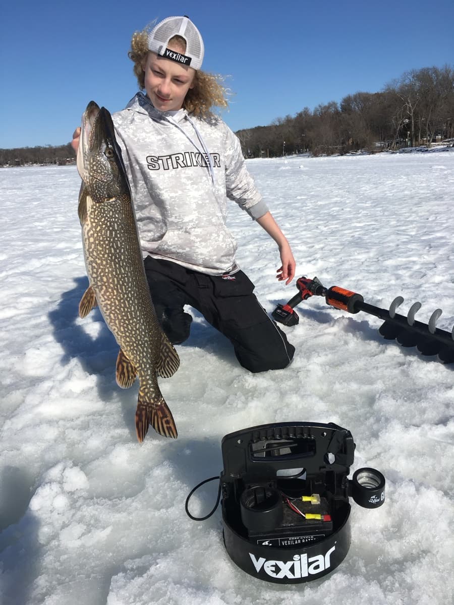 Will holding a pike close-up with Vexilar and Striker